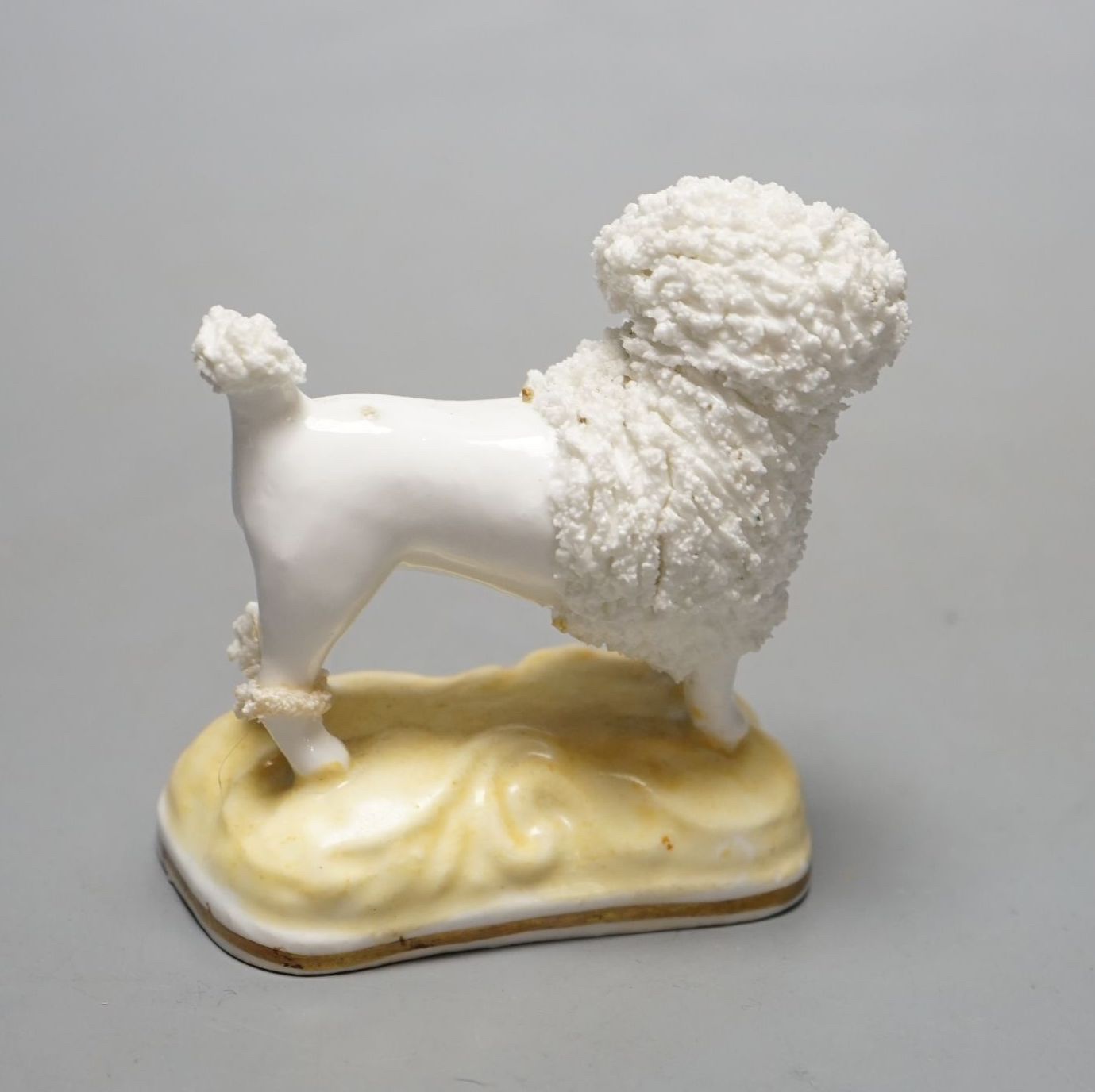 A rare Samuel Alcock porcelain figure of a standing poodle holding a hat in its mouth, c.1835-50, impressed ‘17’, Provenance: Dennis G. Rice collection, apparently an unrecorded model when Dr Rice published his book., 8.